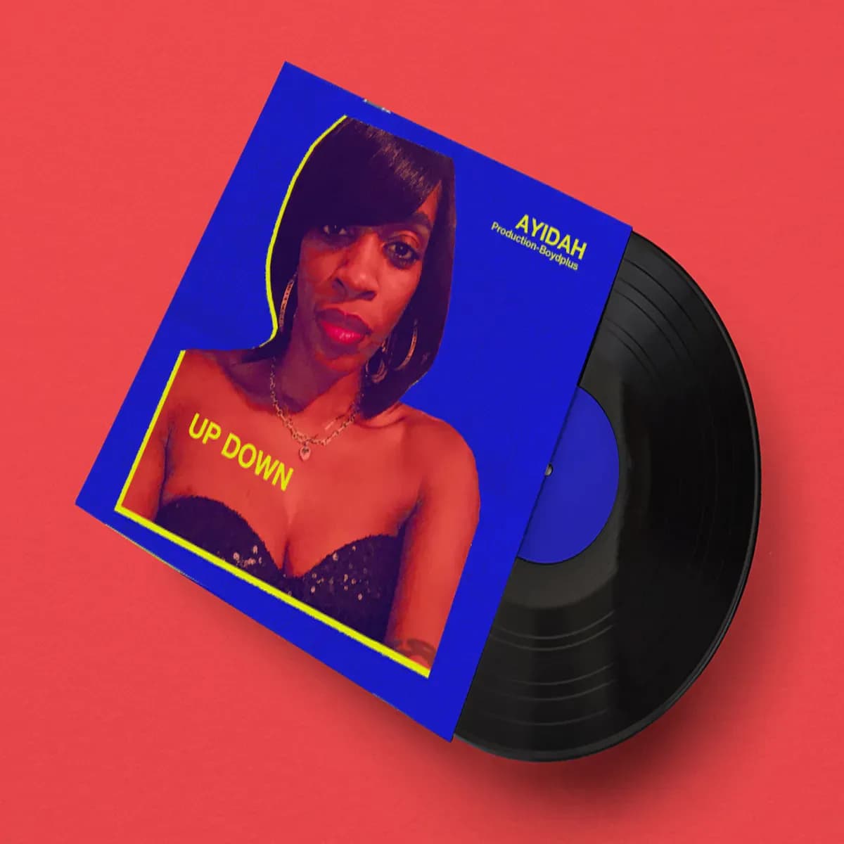 Vinyl with a woman on the cover and text that says, "Up Down" on her chest