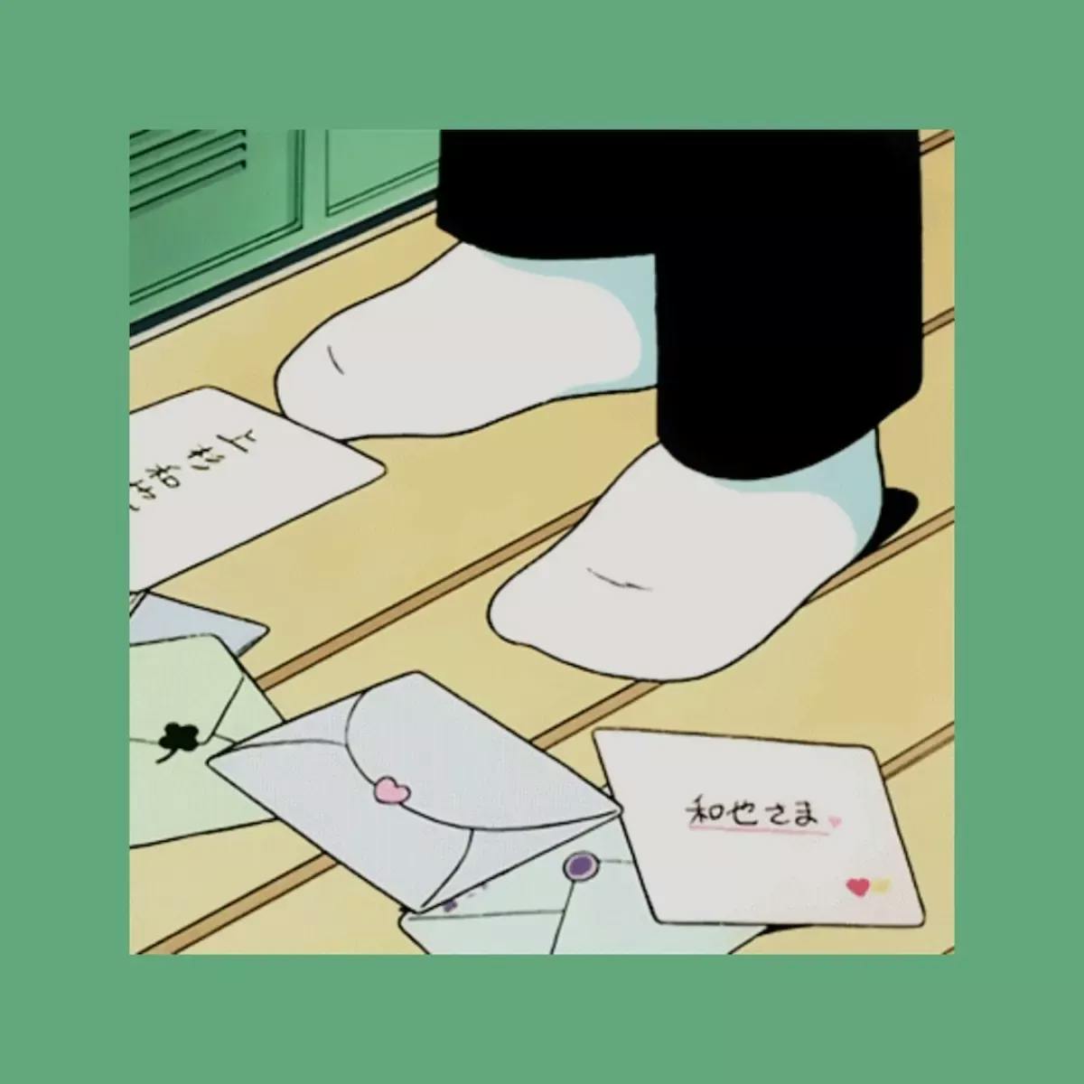 close up of feet on the ground with socks and cards surrounding the feet