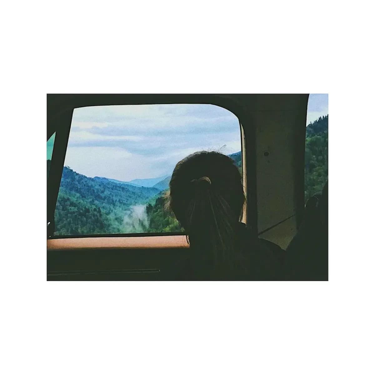 A girl looking out the car window