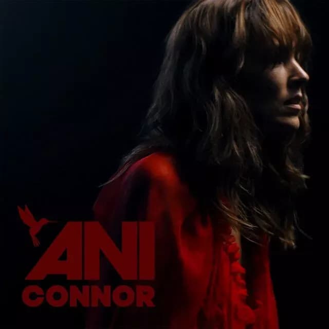 Woman facing the right side with text "Ani Connor"