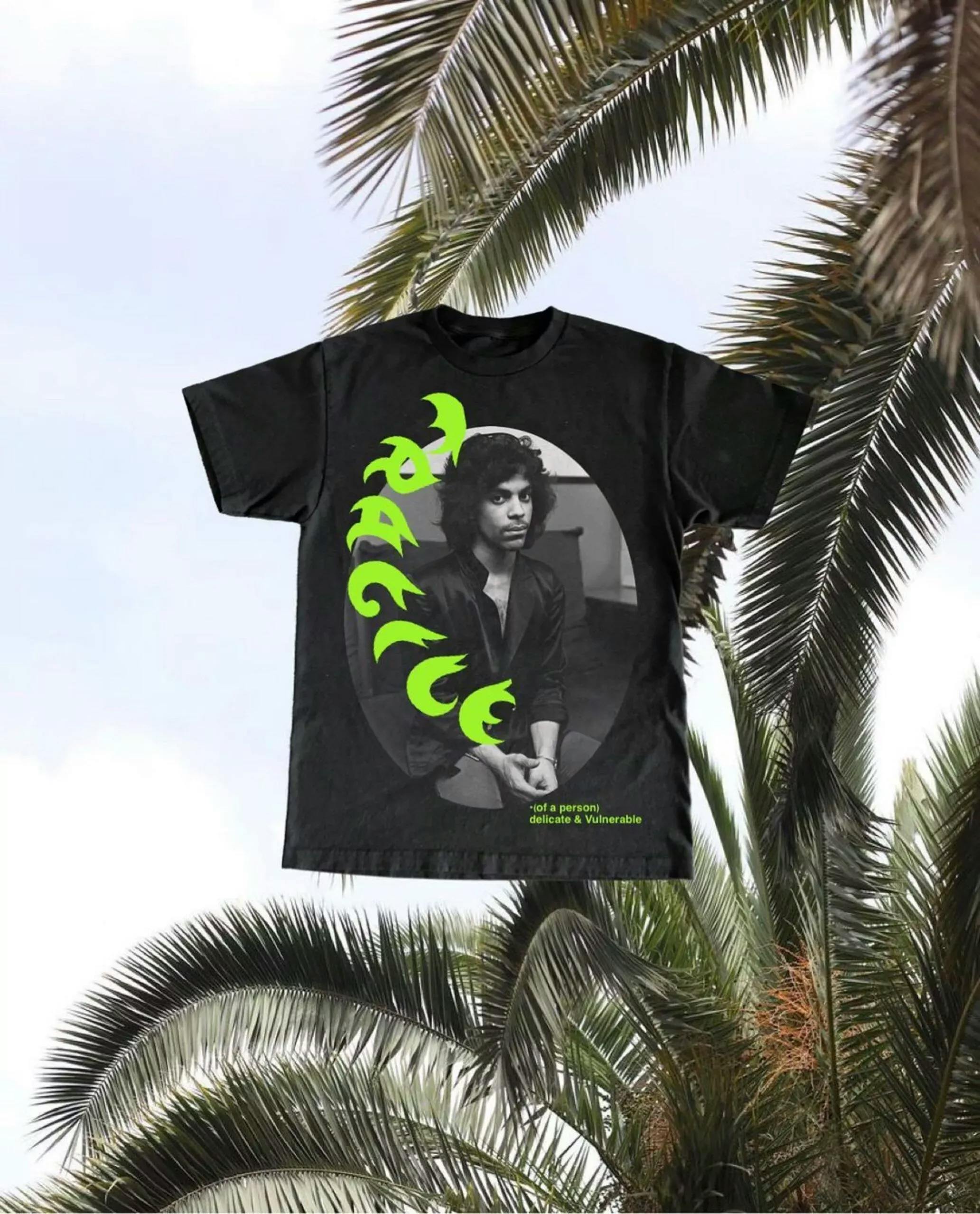 T-shirt with singer Prince on it and green text